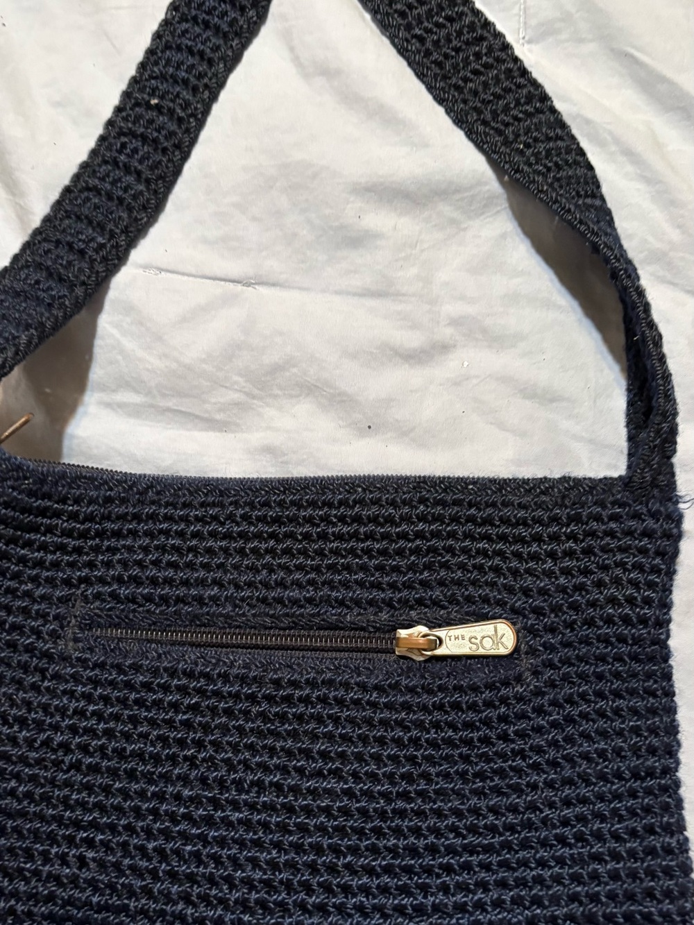 The Sak Black Crochet Shoulder Bag with Gold-Tone Zip Pull